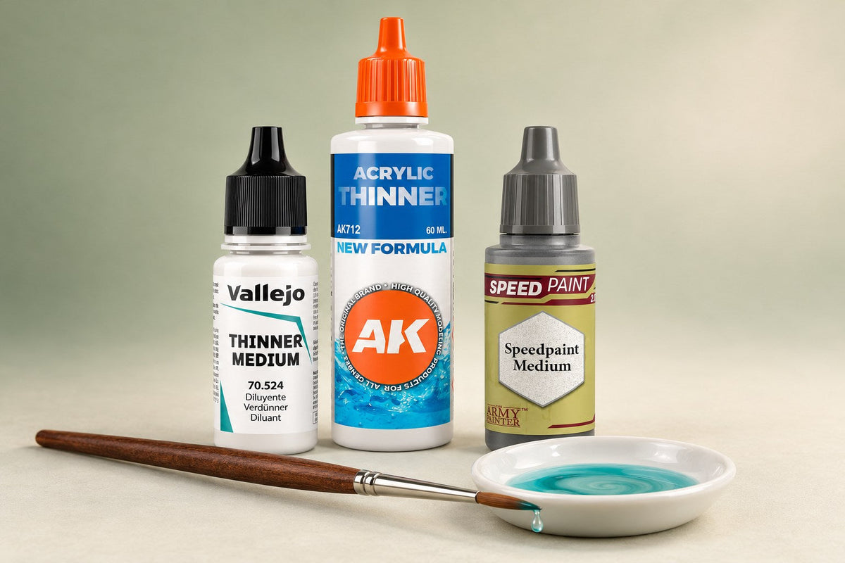 Vallejo Thinner Medium, AK Interactive Acrylic Thinner and Army Painter Speedpaint Medium bottles with a brush and a dish of thinned teal paint