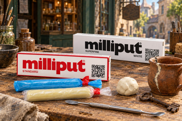 Milliput Standard and Superfine White packs on a tinker's workbench in a Chapmen town street